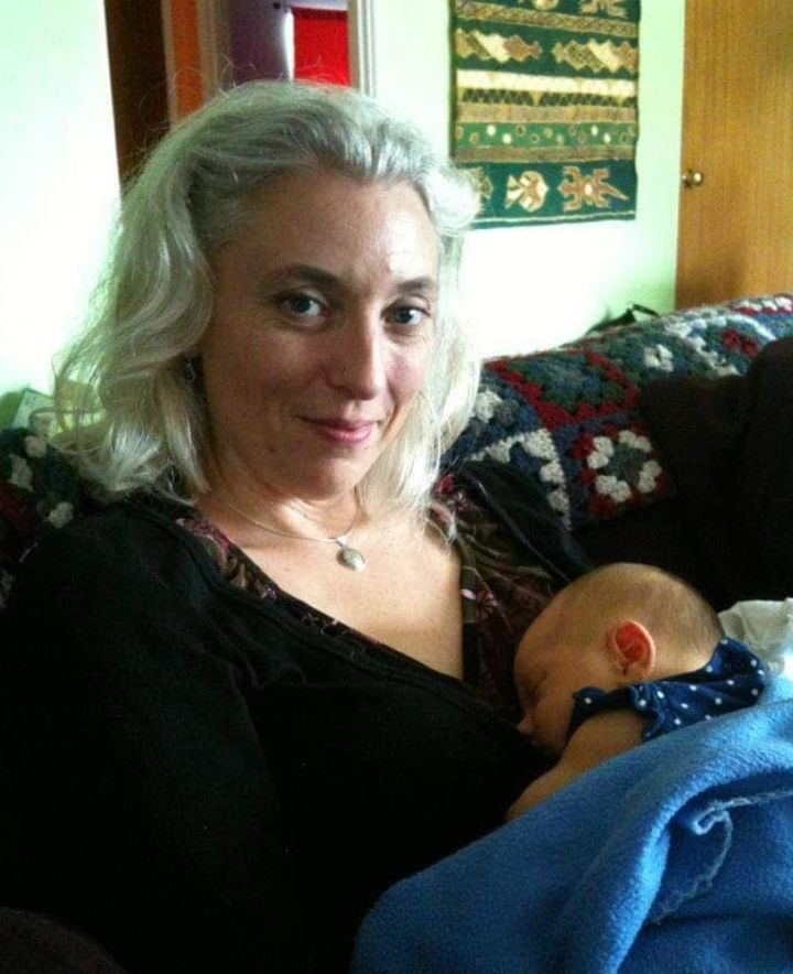 The author meeting her best friend's new baby in 2015.