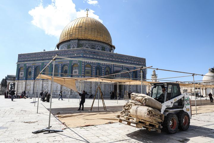 A forklift truck is seen carrying rolled fabric sheets at the courtyards of Al-Aqsa Mosque. Palestinians set up shelters in the courtyards of Al-Aqsa Mosque to protect worshipers from the heat of the sun. The holy month of Ramadan is a month of fasting, which is considered one of the pillars of Islam.