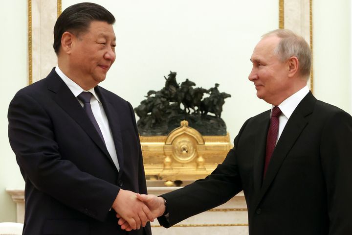 Chinese President Xi Jinping, left, and Russian President Vladimir Putin shake hands during their meeting at the Kremlin in Moscow, Russia, on March 20, 2023.