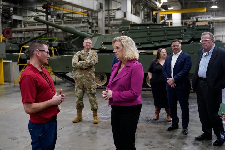 Army Secretary Christine Wormuth stands next to the latest version of the M1A2 Abrams main battle tank as she tours the Joint Systems Manufacturing Center, Thursday, Feb. 16, 2023, in Lima, Ohio. U.S. officials have said they plan to speed up the delivery of Abrams tanks to Ukraine by opting to send a refurbished, older model of the battle tank.