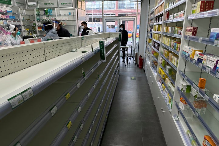 Empty shelves are seen in a pharmacy as customers tries to find medicine to prepare for a wave of COVID-19 outbreak in Beijing, on Dec. 13, 2022.