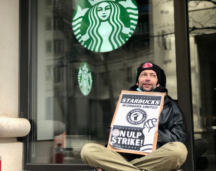Starbucks workers Sam Dukore on strike outside his store in Arlington, Virginia.