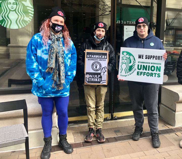 From left to right, Starbucks workers Jayde Coler, Sam Dukore and René Klerian on strike outside their store in Arlington, Virginia.