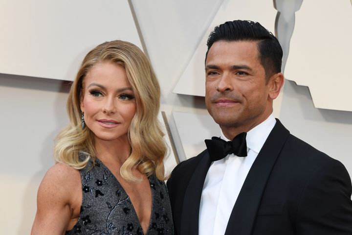 TV personalities Kelly Ripa and Mark Consuelos arrive for the Academy Awards in Los Angeles on Feb. 24, 2019.