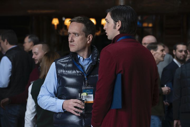 Tom (Matthew Macfadyen) and Cousin Greg (Nicholas Braun) attending Argestes, an elite corporate conference in Season 2 of "Succession." Tom is visibly disappointed when Greg informs him he received the nut and fruit box, not Champagne and a paperweight.