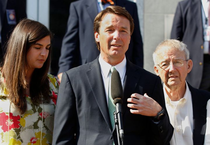 Ex-presidential candidate John Edwards speaks outside a federal courthouse as his daughter, Cate Edwards, left, and father Wallace Edwards, listen after jurors acquitted Edwards on one charge and deadlocked on the other five.
