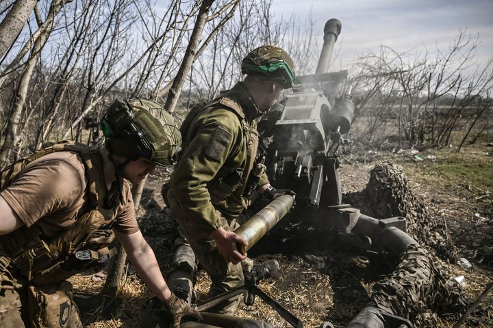 Ukrainian servicemen fire at Russian positions near Bakhmut, on March 23, 2023.