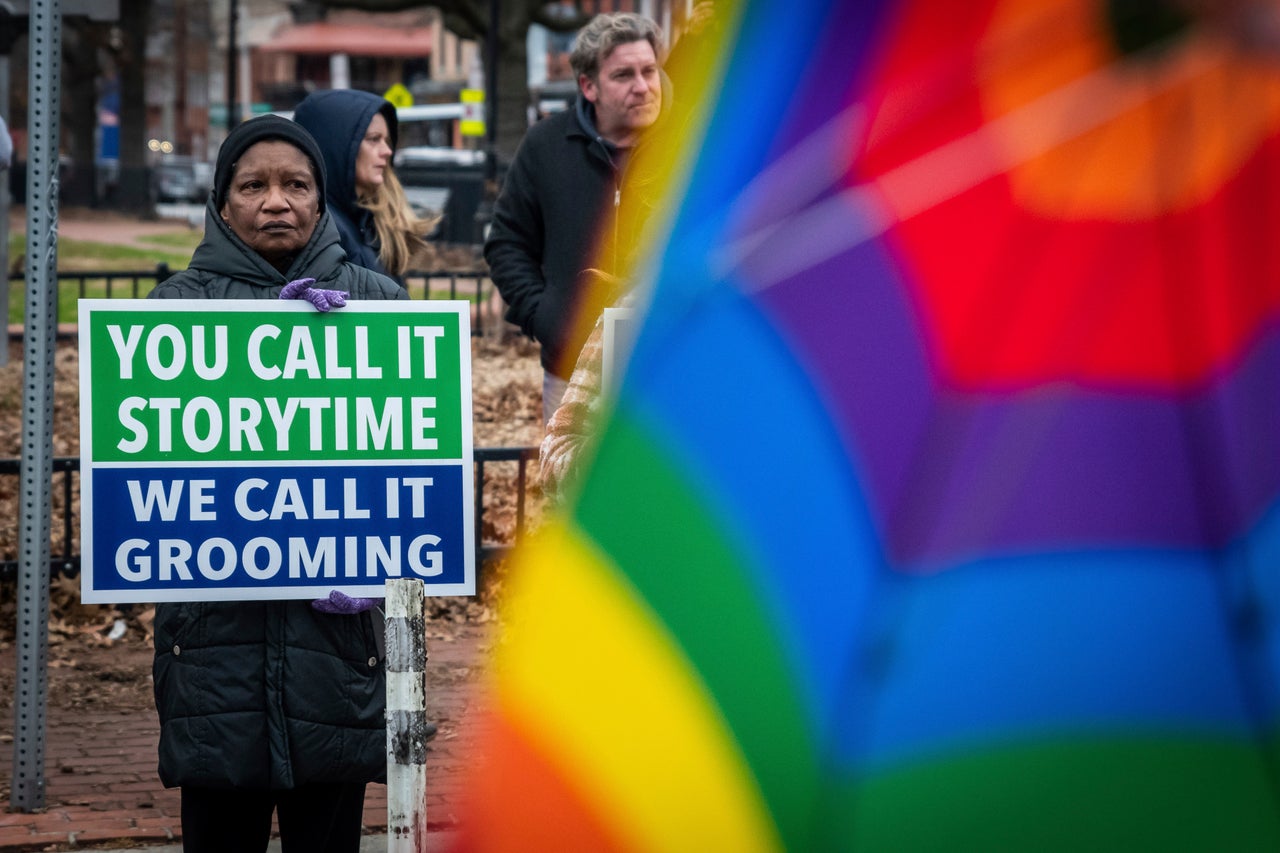 A protester stands outside a drag queen storytime event at the Church on the Square in Baltimore on Jan. 14, 2023. Opponents of these events throw out terms like “grooming” to suggest that the drag performers have dark ulterior motives. 