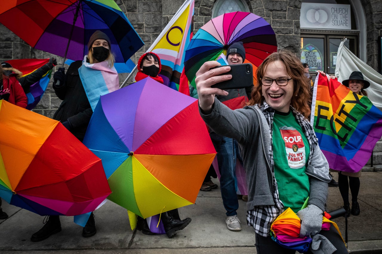 Supporters of a drag queen storytime event pose for a selfie in front of the Church on the Square in Baltimore on Jan. 14, 2023.