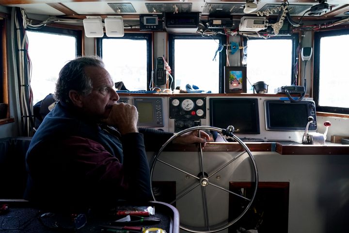 Bob Maharry sits inside his fishing boat docked at Pier 45 in San Francisco, Monday, March 20, 2023.