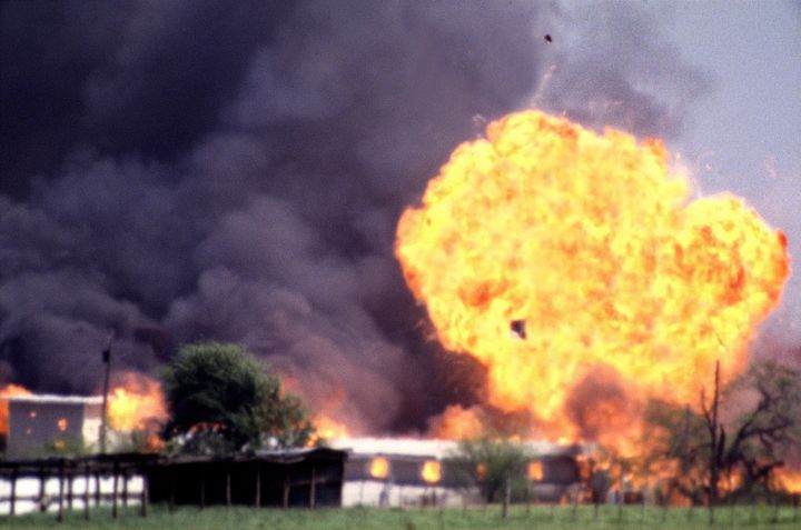 The Branch Davidian compound explodes in a burst of flames on April 19, 1993, ending the standoff between cult leader David Koresh and his followers and federal law enforcement.