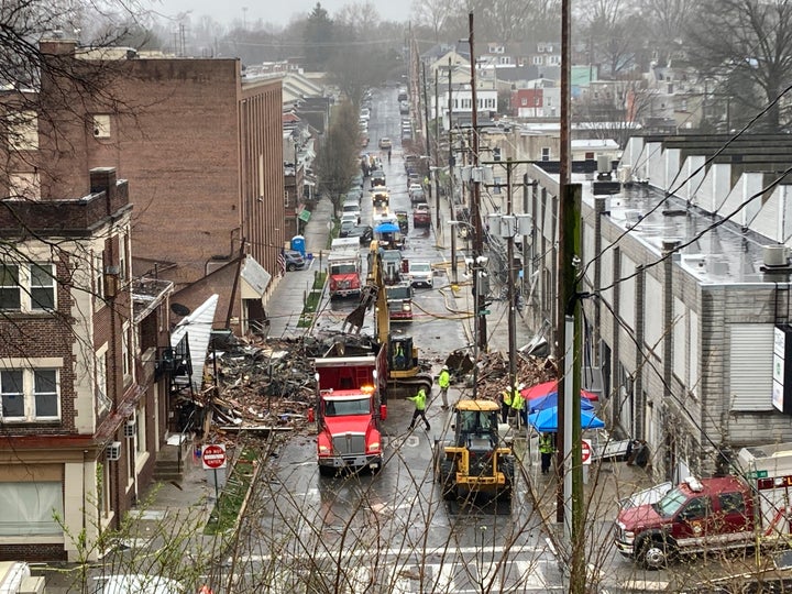 Emergency responders and heavy equipment are seen at the site of a deadly explosion at a chocolate factory in West Reading, Pennsylvania, Saturday, March 25. (AP Photo/Michael Rubinkam)