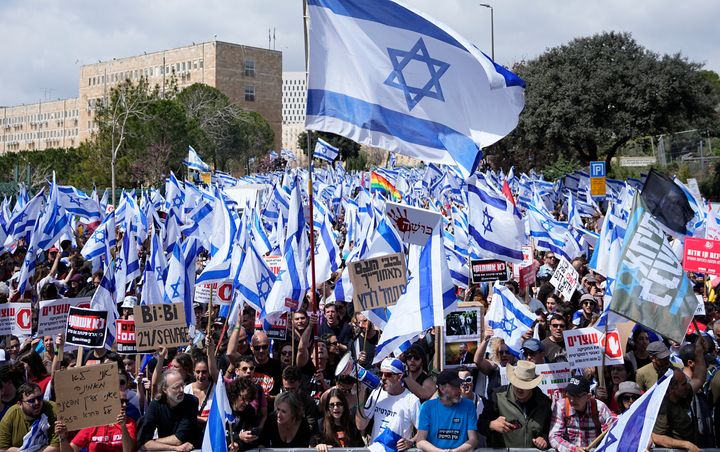 Israelis protest against Prime Minister Benjamin Netanyahu's judicial overhaul plan outside the Parliament in Jerusalem, March 27, 2023. 