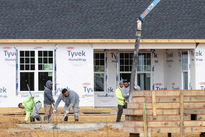 Workers lay a foundation at a new home construction site in Trappe, Maryland, on Oct. 28, 2022.