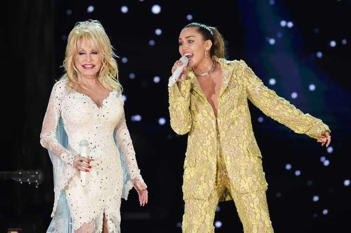Dolly Parton (left) and Miley Cyrus performing at the 2019 Grammy Awards. 