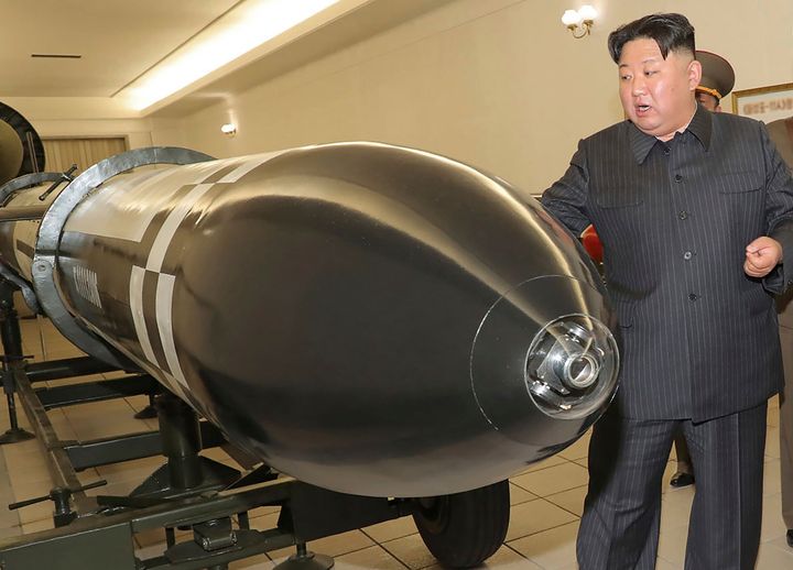 This photo provided on March 28, 2023, by the North Korean government, shows North Korean leader Kim Jong Un visiting a hall displaying what appear to be various types of warheads designed to be mounted on missiles or rocket launchers on March 27, 2023, in an undisclosed location. Independent journalists were not given access to cover the event depicted in this image.