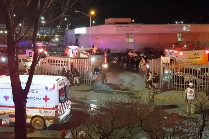 Image taken from a video showing ambulances and rescue teams staffers outside an immigration center in Ciudad Juarez, Mexico, on March 28, 2023.