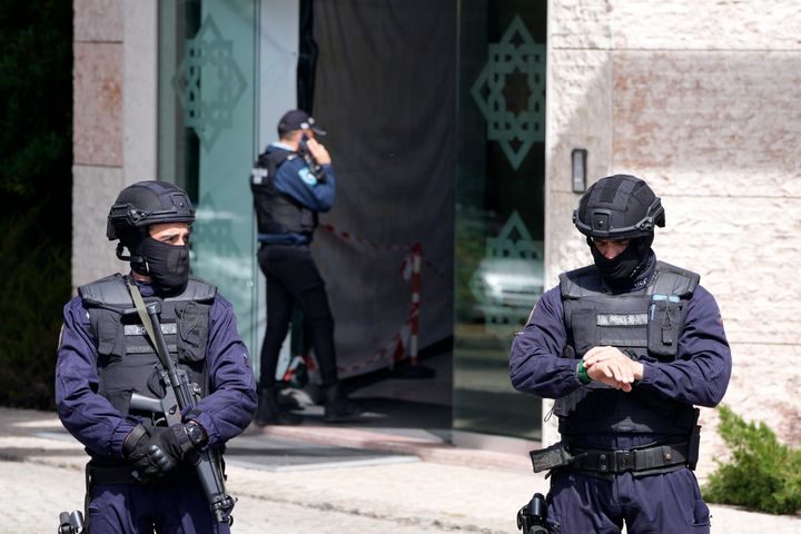 Portuguese police have shot a man suspected of stabbing two people to death at an Ismaili Muslim center in Lisbon.