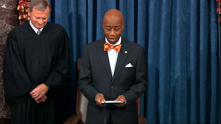 In this image from a video, Chief Justice of the United States John Roberts smiles as Senate chaplain retired Navy Adm. Barry Black wishes him a happy birthday during the opening prayer during the impeachment trial against President Donald Trump in the Senate at the U.S. Capitol in Washington, Monday, Jan. 27, 2020.