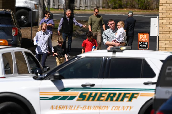 Families leave a reunification site in Nashville, Tenn., Monday, March 27, 2023 after several children were killed in a shooting at Covenant School in Nashville. The suspect is dead after a confrontation with police. (AP Photo/John Amis)