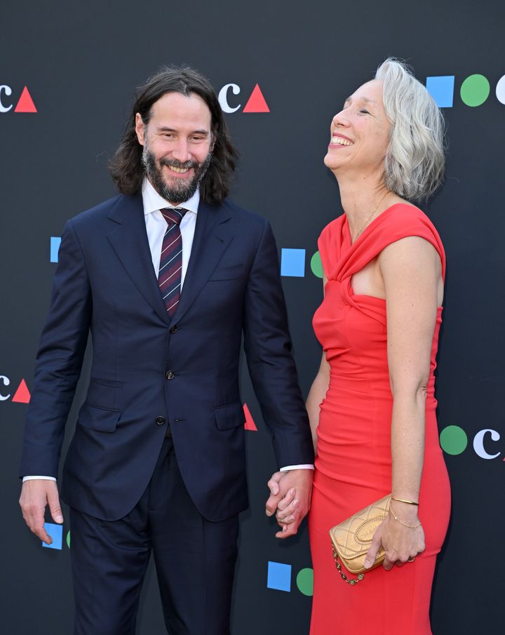 Keanu Reeves and Alexandra Grant laugh together on the red carpet on June 4 in Los Angeles.