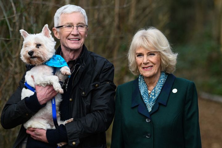 Britain's Camilla and the Queen Consort (R) poses with Battersea Ambassador, Paul OGrady during her visit to Battersea Brand Hatch Centre on February 2, 202.