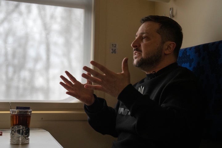 Ukrainian President Volodymyr Zelenskyy gestures as he speaks during an interview with Julie Pace, senior vice president and executive editor of The Associated Press, on a train traveling from the Sumy region to Kyiv, Ukraine, on March 28, 2023.