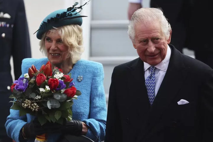 Britain's King Charles III and Camilla, the Queen Consort, arrive at the airport in Berlin, Wednesday, March 29, 2023. King Charles III arrives Wednesday for a three-day official visit to Germany.