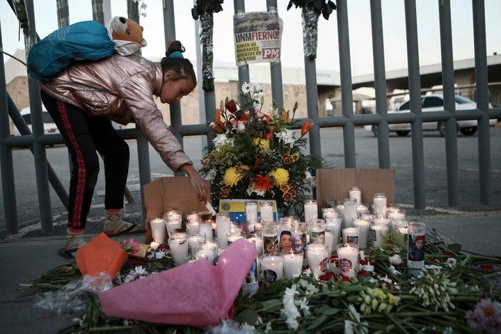 A girl lights candle during a vigil for the victims of a fire at an immigration detention center that killed dozens in Ciudad Juarez, Mexico, Tuesday, March 28, 2023. According to Mexican President Andres Manuel Lopez Obrador, migrants fearing deportation set mattresses ablaze at the center, starting the fire. (AP Photo/Christian Chavez)