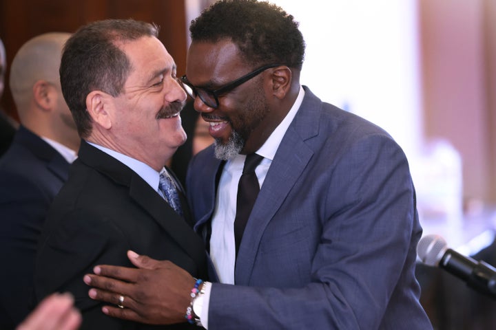 U.S. Rep. Jesus "Chuy" García (left) greets Brandon Johnson at an endorsement event on March 17. García's blessing could be helpful to Johnson with Latino voters.