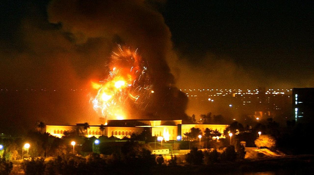 Smoke covers the presidential palace compound in Baghdad on March 21, 2003, during a massive U.S.-led air raid on the Iraqi capital.