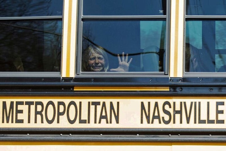 A child weeps while on the bus leaving The Covenant School, following a mass shooting at the school in Nashville, Tennessee, on March 27, 2023.