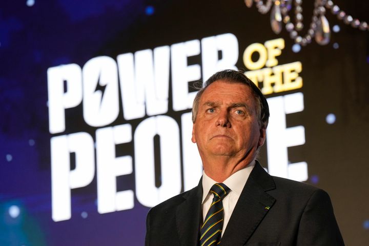 FILE – Brazil's right wing former President Jair Bolsonaro speaks at an event hosted by conservative group Turning Point USA at Trump National Doral Miami in February. A horde of his supporters stormed and ransacked the capital's most important government buildings on Jan. 8, one week after Lula took office, seeking to oust the new president from power.