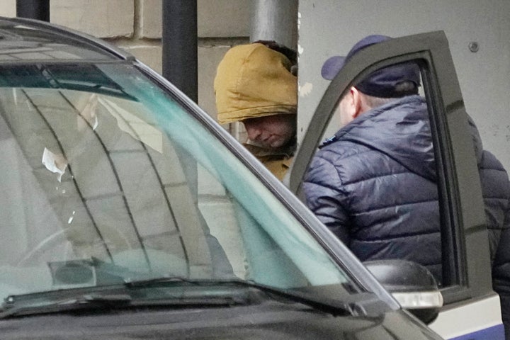Wall Street Journal reporter Evan Gershkovich is escorted by officers from the Lefortovsky court to a vehicle, in Moscow, Russia, on March 30, 2023.