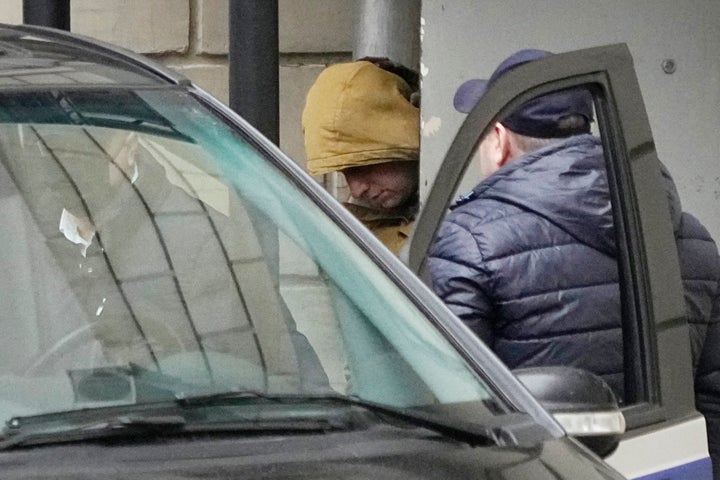 Wall Street Journal reporter Evan Gershkovich is escorted by officers from the Lefortovsky court to a vehicle, in Moscow, Russia, on March 30, 2023. 