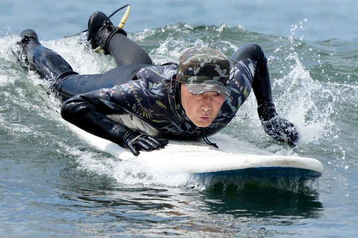 Seiichi Sano, an 89-year-old Japanese man, has been recognized by the Guinness World Records as the oldest male to surf. (AP Photo/Eugene Hoshiko)