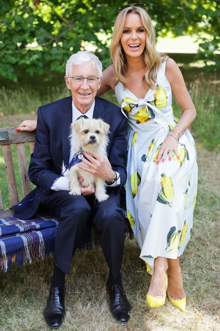 Paul O Grady and Amanda Holden pose during a reception for the 160th Anniversary of the Battersea Dogs and Cats Home animal welfare charity at Clarence House on July 14, 2022.