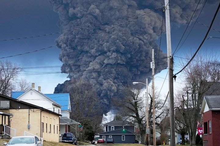 FILE - A black plume rises over East Palestine, Ohio, as a result of a controlled detonation of a portion of the derailed Norfolk Southern trains, Feb. 6, 2023. The federal government filed a lawsuit Thursday, March 30, against railroad Norfolk Southern over environmental damage caused by a February derailment on the Ohio-Pennsylvania border that spilled hazardous chemicals into nearby creeks and rivers.(AP Photo/Gene J. Puskar, File)