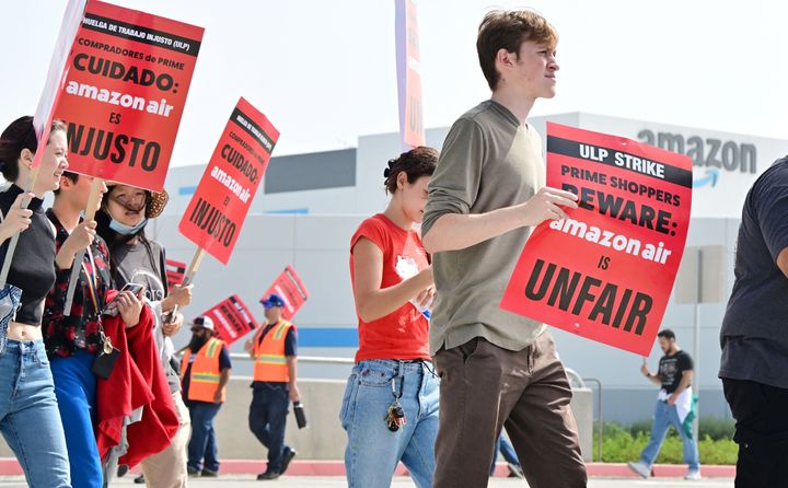 Workers at Amazon's West Coast Air Freight Fulfillment Center in San Bernardino, California, protest outside the facility on Oct. 14, 2022, over claims of an unsafe work environment and low wages.