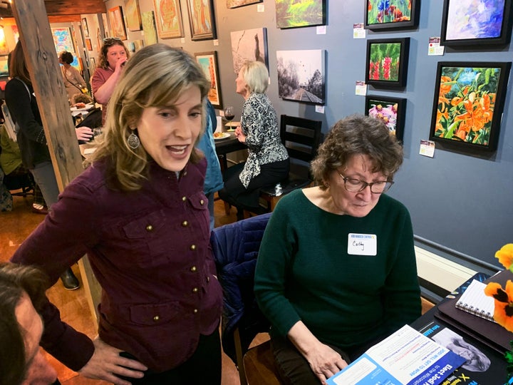 Jodi Habush Sinykin (left) speaks to voters at a March 23 fundraiser in the Milwaukee suburbs. A win for Habush Sinykin, a Democratic state Senate candidate, would deprive Republicans of a supermajority in the upper legislative body.