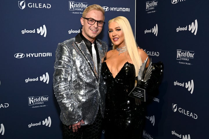 Michael Anderson, left, and Christina Aguilera.