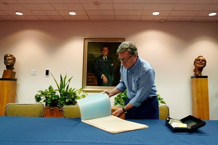 Peter Mangan flips done a ample folder of paper clippings astatine the Lyndon B. Johnson's statesmanlike room arsenic helium prepares to marque a donation to the library, Wednesday, Aug. 31, 2022, successful Austin, Texas. The household of the precocious Associated Press newsman James W. Mangan has donated to the room cassette tapes containing interviews the newsman did that led to a 1977 communicative successful which a Texas voting authoritative elaborate however 3 decades earlier, votes were falsified to springiness Johnson a slim triumph successful a U.S. Senate primary. (AP Photo/Eric Gay)