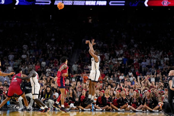 San Diego State guard Lamont Butler scores the game winning basket against Florida Atlantic in a Final Four college basketball game in the NCAA Tournament on Saturday, April 1, 2023, in Houston. (AP Photo/Brynn Anderson)