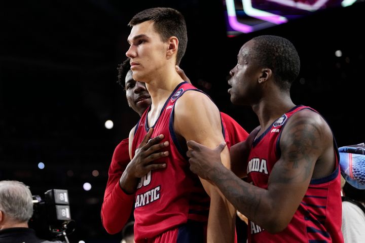 Florida Atlantic center Vladislav Goldin, left, reacts to their loss against San Diego State in a Final Four college basketball game in the NCAA Tournament on Saturday, April 1, 2023, in Houston. (AP Photo/David J. Phillip)