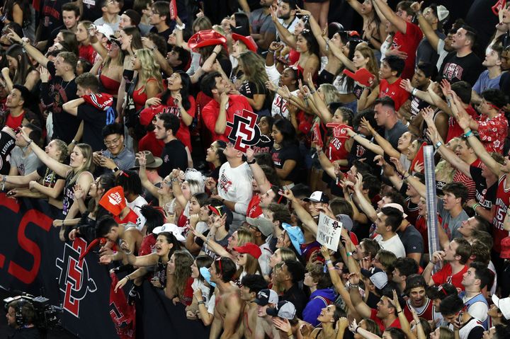 HOUSTON, TEXAS - APRIL 01: San Diego State Aztecs fans celebrate after defeating the Florida Atlantic Owls 72-71 during the NCAA Men's Basketball Tournament Final Four semifinal game at NRG Stadium on April 01, 2023 in Houston, Texas. (Photo by Mike Lawrie/Getty Images)