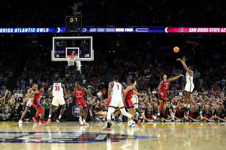 HOUSTON, TEXAS - APRIL 01: Lamont Butler #5 of the San Diego State Aztecs makes a basket as the clock expires to defeat the Florida Atlantic Owls 72-71 during the NCAA Men's Basketball Tournament Final Four semifinal game at NRG Stadium on April 01, 2023 in Houston, Texas. (Photo by Gregory Shamus/Getty Images)