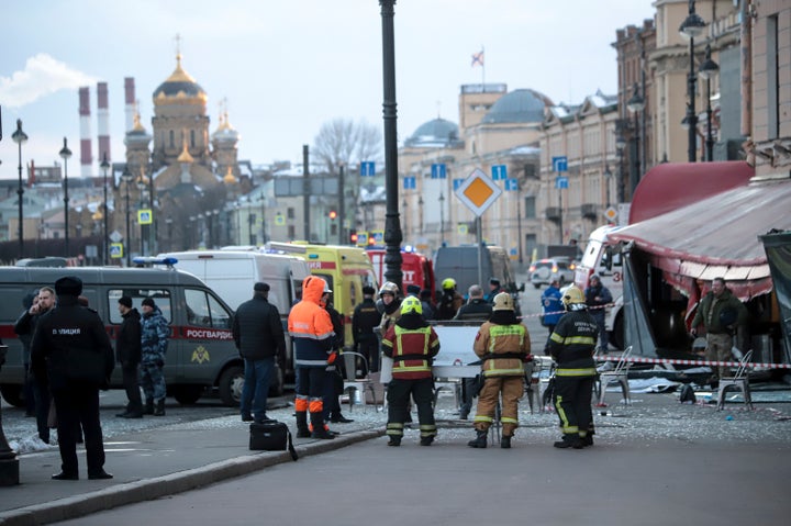 Russian Emergency Situations Ministry stand at the side of an explosion at a cafe in St. Petersburg, Russia, Sunday, April 2, 2023. (AP Photo)