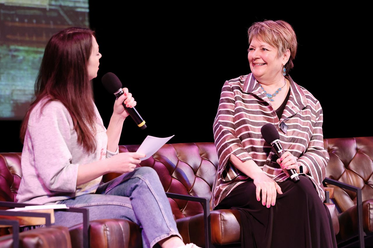 Protasiewicz (right) speaks during a live taping of the liberal podcast, "Pod Save America," in Madison, Wisconsin, on March 18. National groups have converged on the state ahead of Tuesday's election.