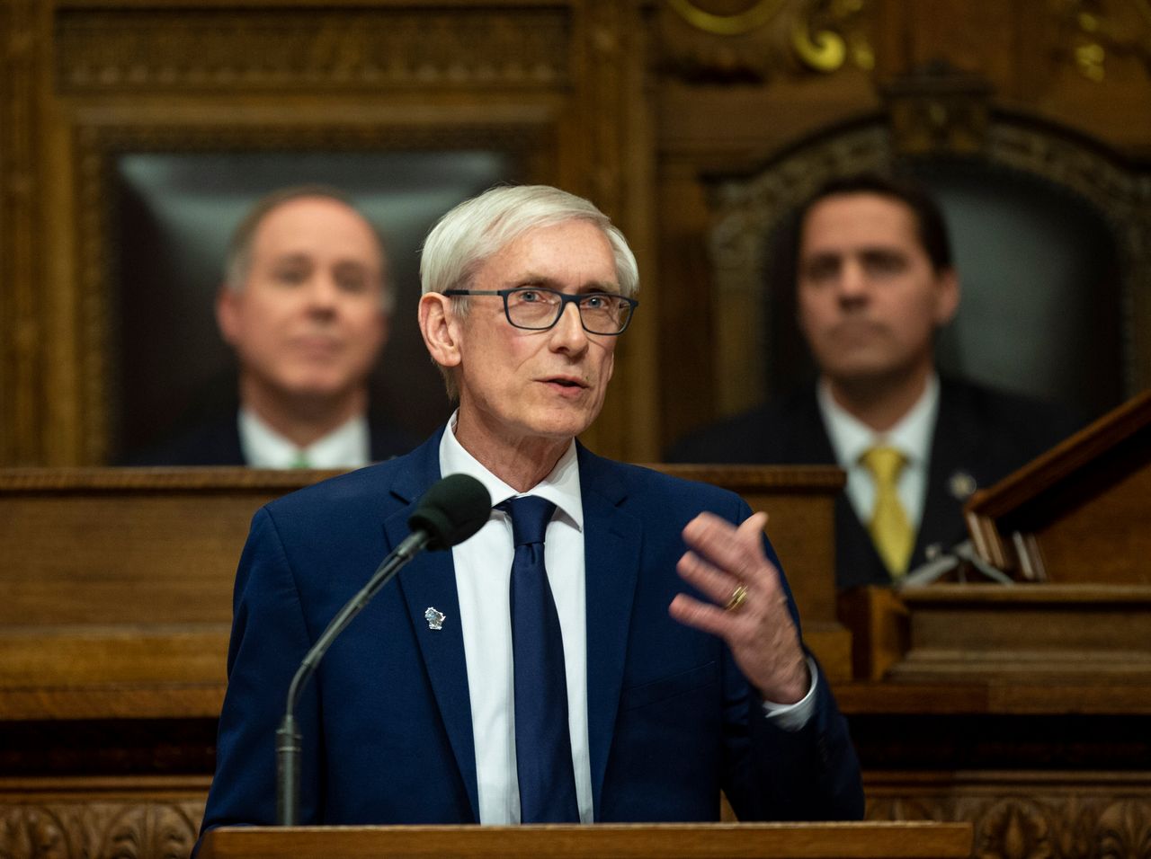 As Wisconsin Gov. Tony Evers (D) speaks in 2019, Republican state legislative leaders look on behind him. GOP leaders often refuse to engage with Evers' proposals.