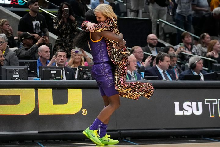 LSU head coach Kim Mulkey celebrates with Flau'jae Johnson during the second half of the NCAA Women's Final Four championship basketball game.